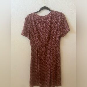 In good condition dress has a zipper on the side